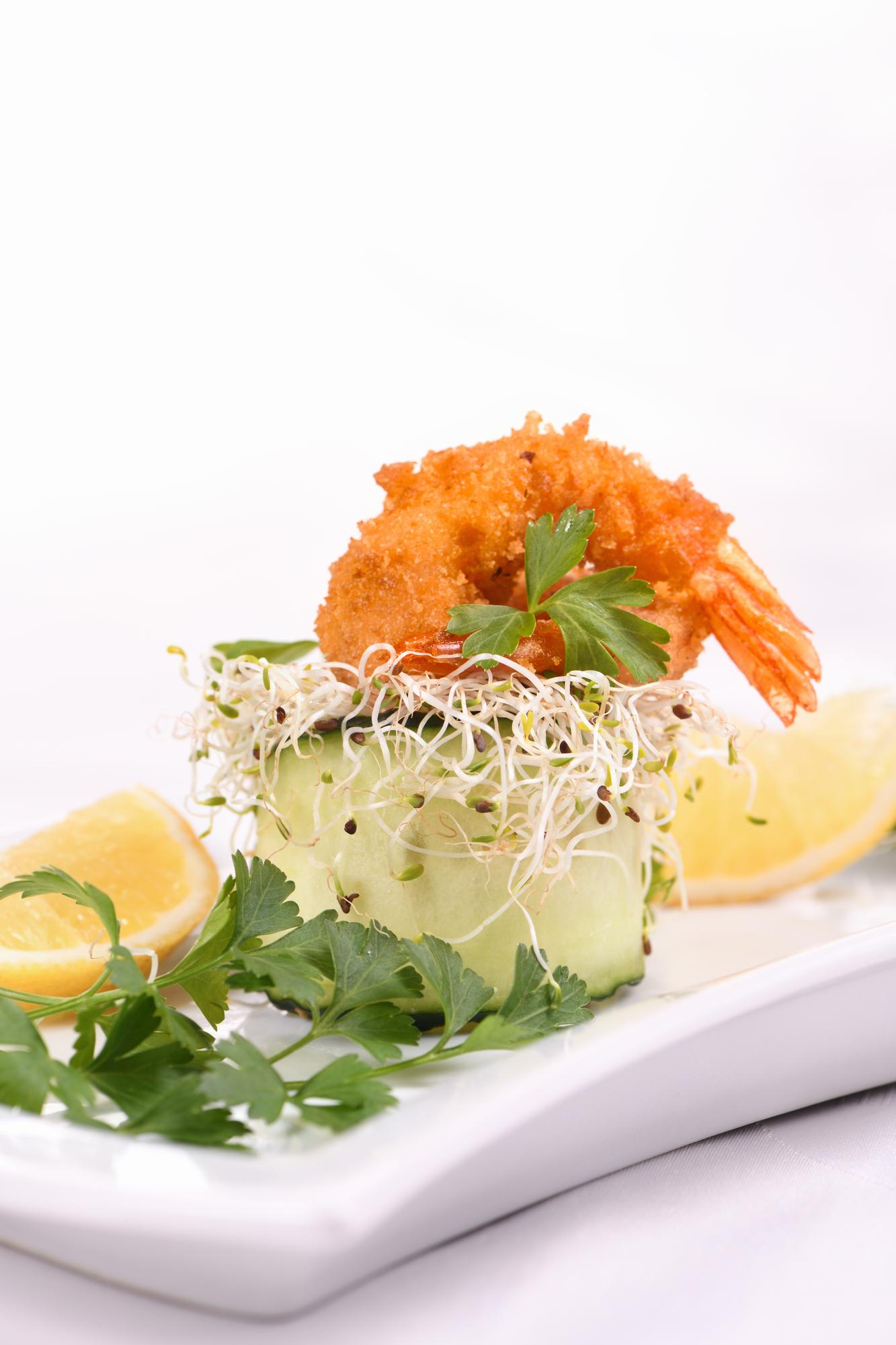 Plated seafood course with microgreens